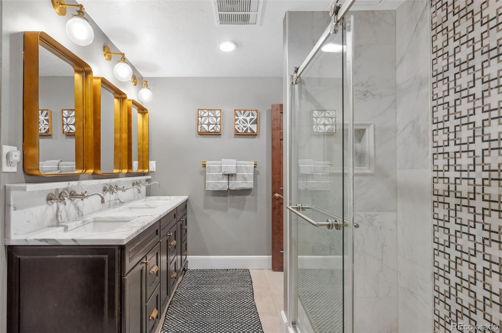 7225 West Box Canyon Road Sedalia, CO 80135 - Photo 35 of 49 a bathroom with a sink and a mirror