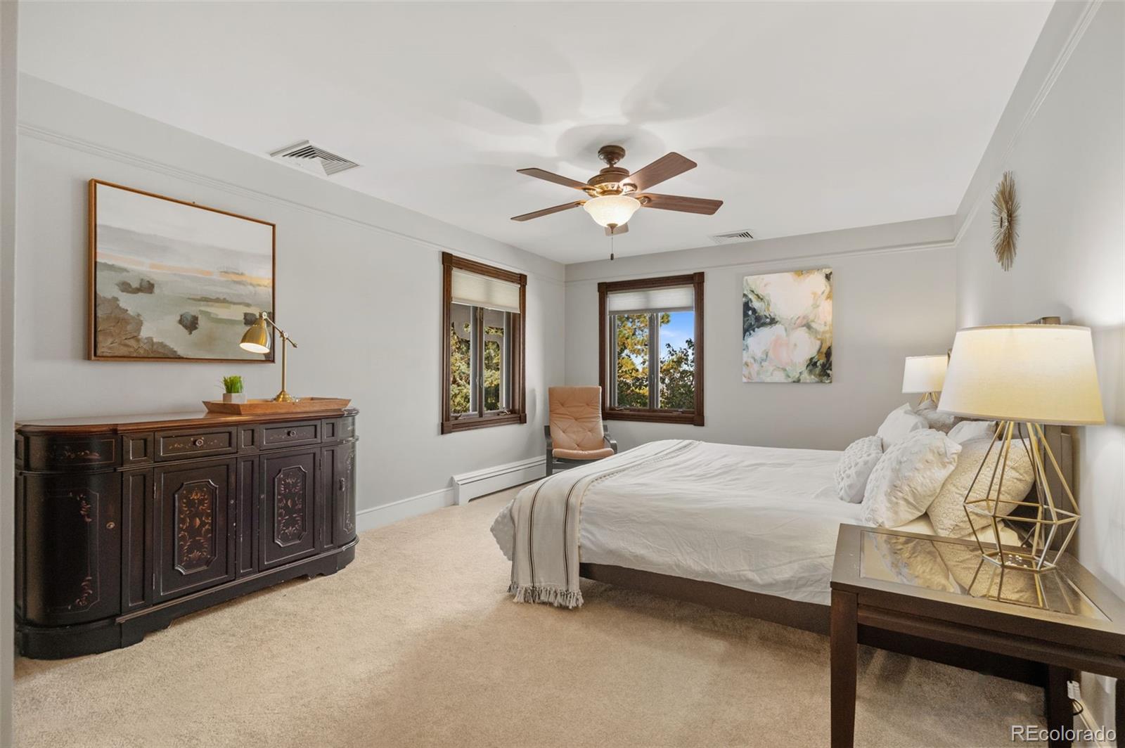 7225 West Box Canyon Road Sedalia, CO 80135 - Photo 36 of 49 a spacious bedroom with a bed and dresser
