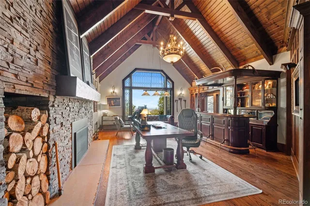 a dining room with furniture and wooden floor