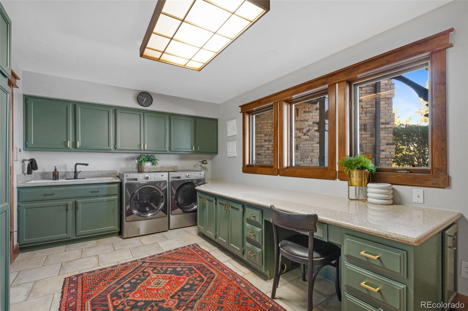 7225 West Box Canyon Road Sedalia, CO 80135 - Photo 42 of 49 a kitchen with a stove a sink and a cabinets