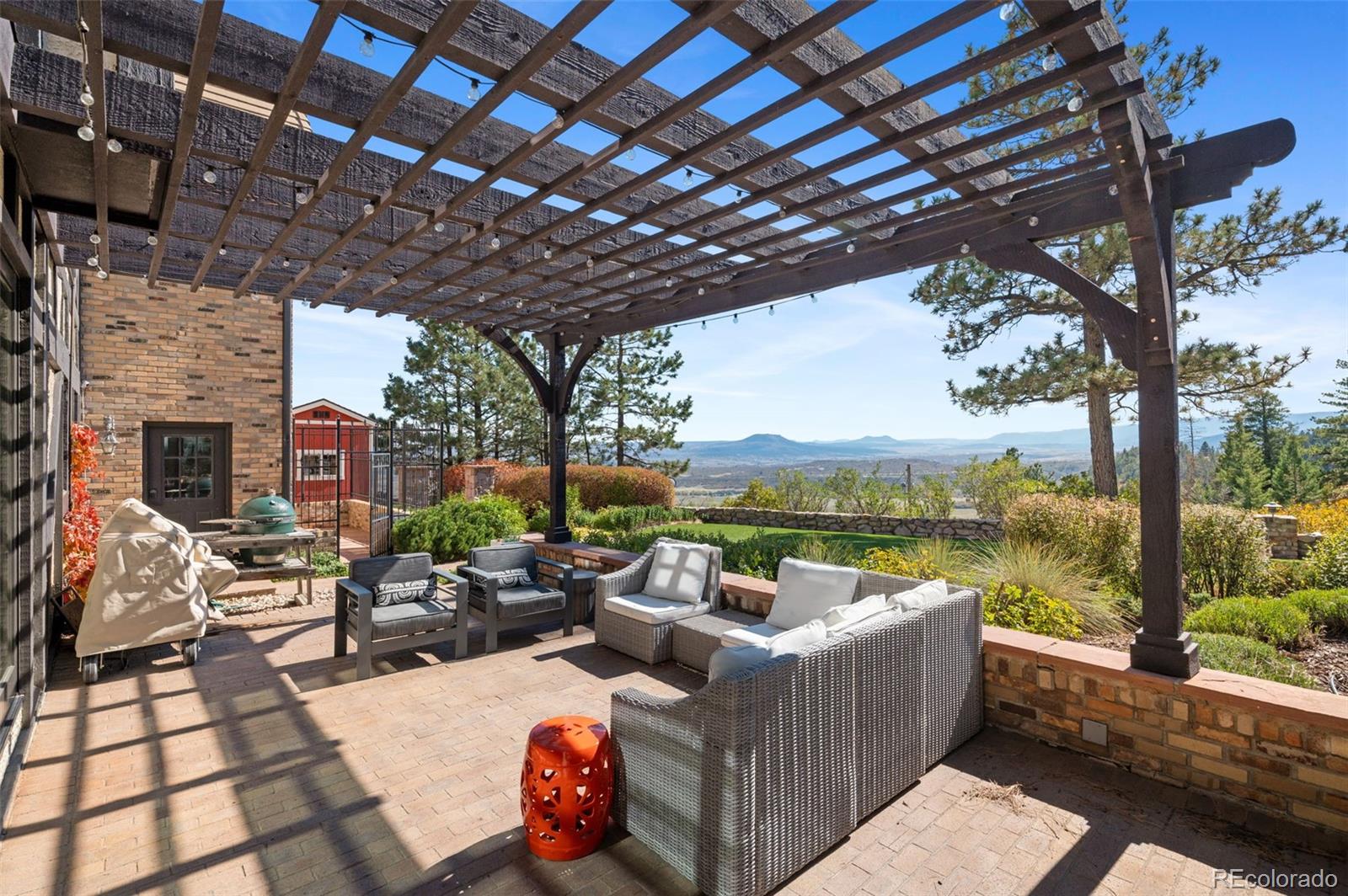 7225 West Box Canyon Road Sedalia, CO 80135 - Photo 45 of 49 a view of a patio with couches and pool