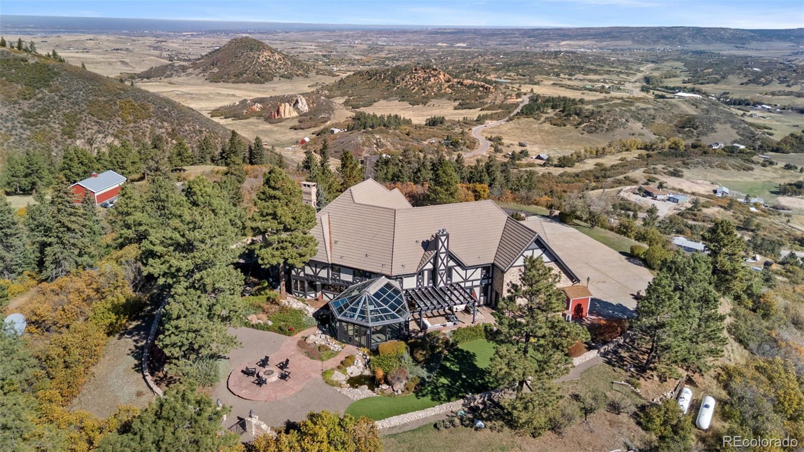 7225 West Box Canyon Road Sedalia, CO 80135 - Photo 47 of 49 an aerial view of a house with a yard