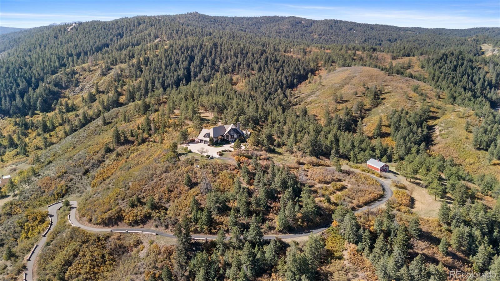 7225 West Box Canyon Road Sedalia, CO 80135 - Photo 47 of 49 a view of a forest with mountains in the background
