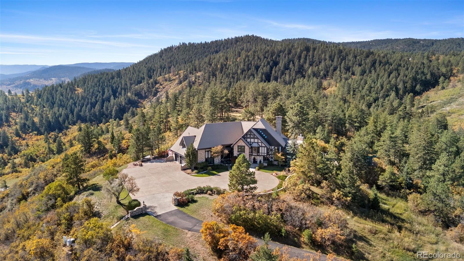 7225 West Box Canyon Road Sedalia, CO 80135 - Photo 48 of 49 a view of a house with a yard