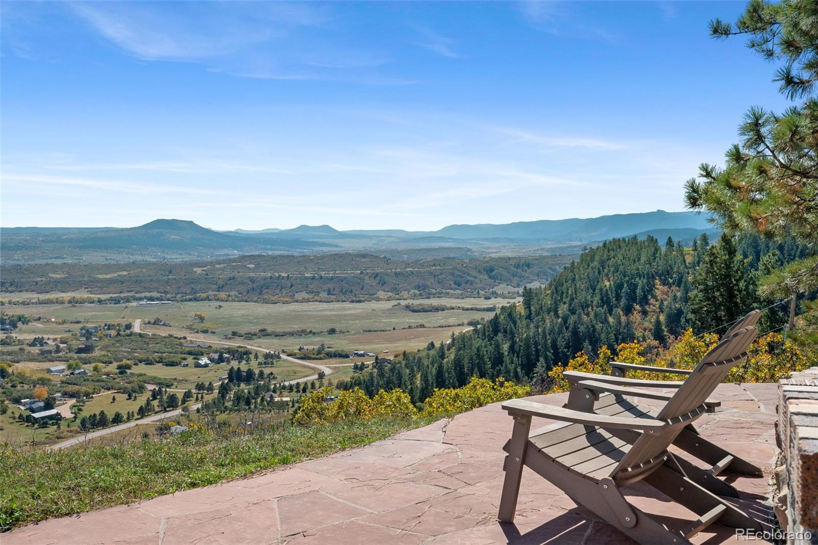 7225 West Box Canyon Road Sedalia, CO 80135 - Photo 6 of 49 a view of a lake with a mountain