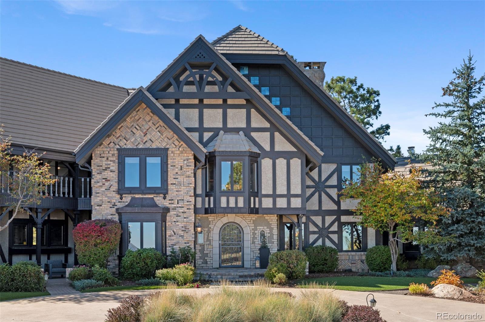 7225 West Box Canyon Road Sedalia, CO 80135 - Photo 7 of 49 a front view of a house with a yard