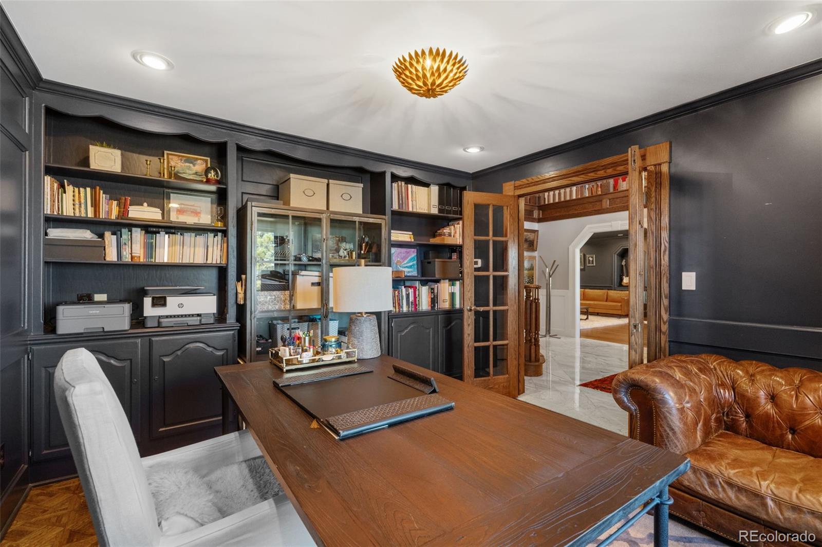 7225 West Box Canyon Road Sedalia, CO 80135 - Photo 10 of 49 a living room with furniture and a table