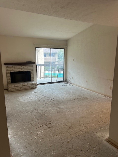 5001 Lamonte Lane, Unit 109 Houston, TX 77092 - Photo 4 of 12 a view of empty room with a fireplace