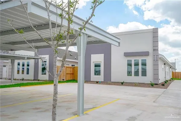 a front view of building with yard