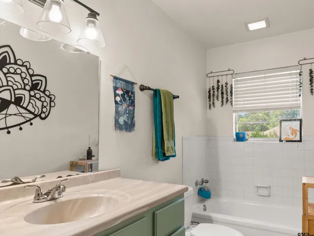 a bathroom with a sink and a bathtub