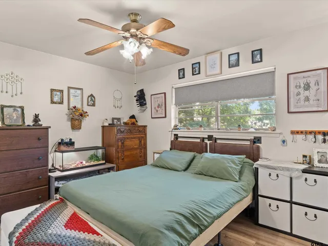 a bedroom with a bed and dresser