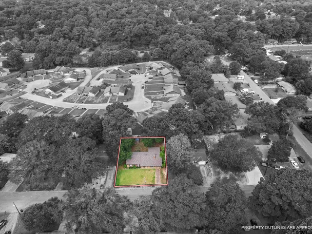 a aerial view of a house with a yard