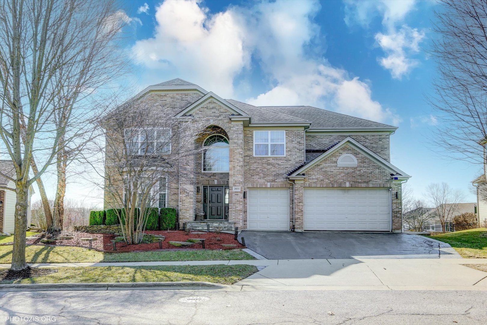 2933 Kelly Drive Elgin, IL 60124 - Photo 1 of 10 a front view of a house with a yard