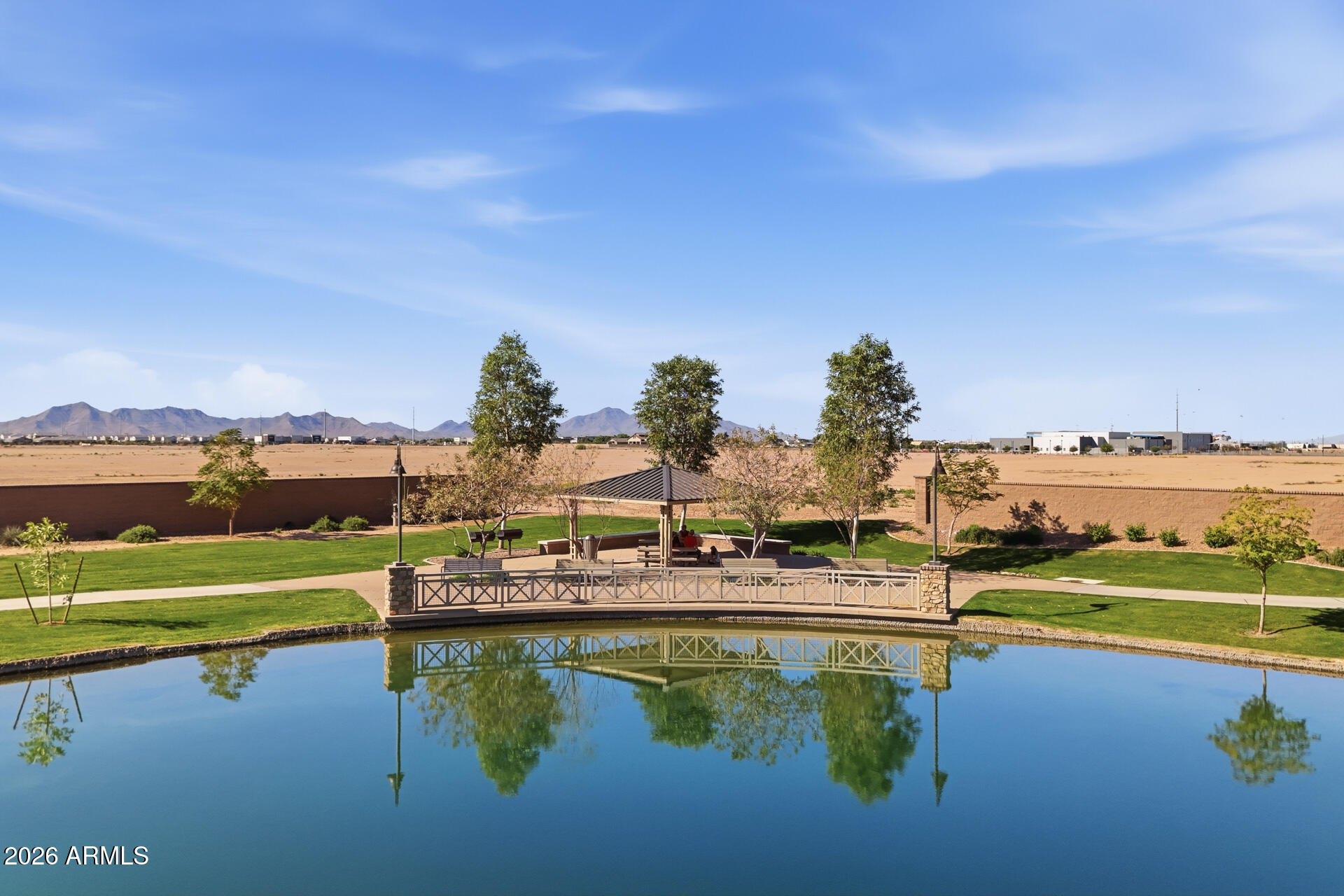 23069 East Mayberry Road Queen Creek, AZ 85142 - Photo 42 of 48 a view of a lake with a city