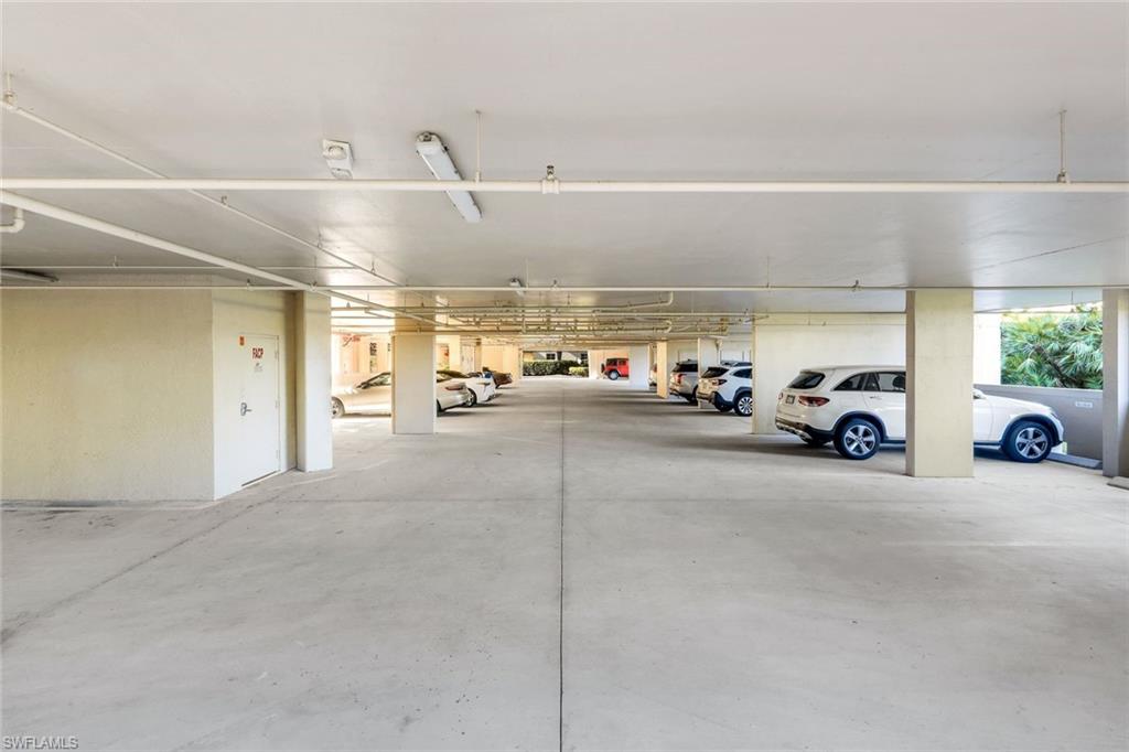 25161 Sandpiper Greens Court, Unit 203 Bonita Springs, FL 34134 - Photo 29 of 36 a view of parking area