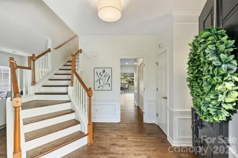 a view of an entryway with wooden floor