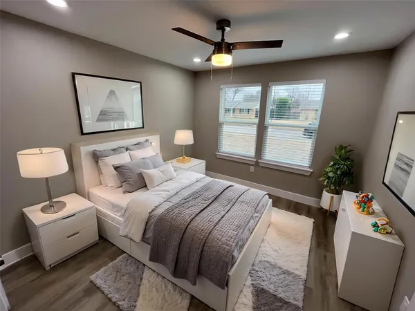 a bedroom with a bed and a tv