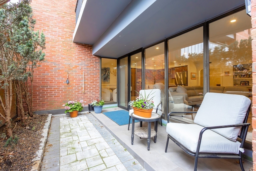75 Grove Street, Unit 132 Wellesley, MA 02482 - Photo 18 of 20 a outdoor living space with furniture and a garden