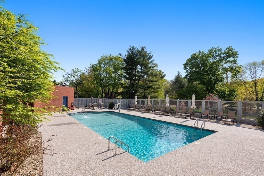 75 Grove Street, Unit 132 Wellesley, MA 02482 - Photo 19 of 20 a view of a house with swimming pool and sitting area