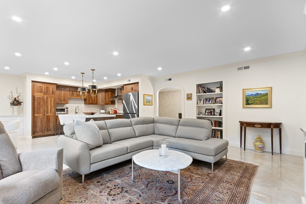 75 Grove Street, Unit 132 Wellesley, MA 02482 - Photo 8 of 20 a living room with furniture kitchen view and a couch