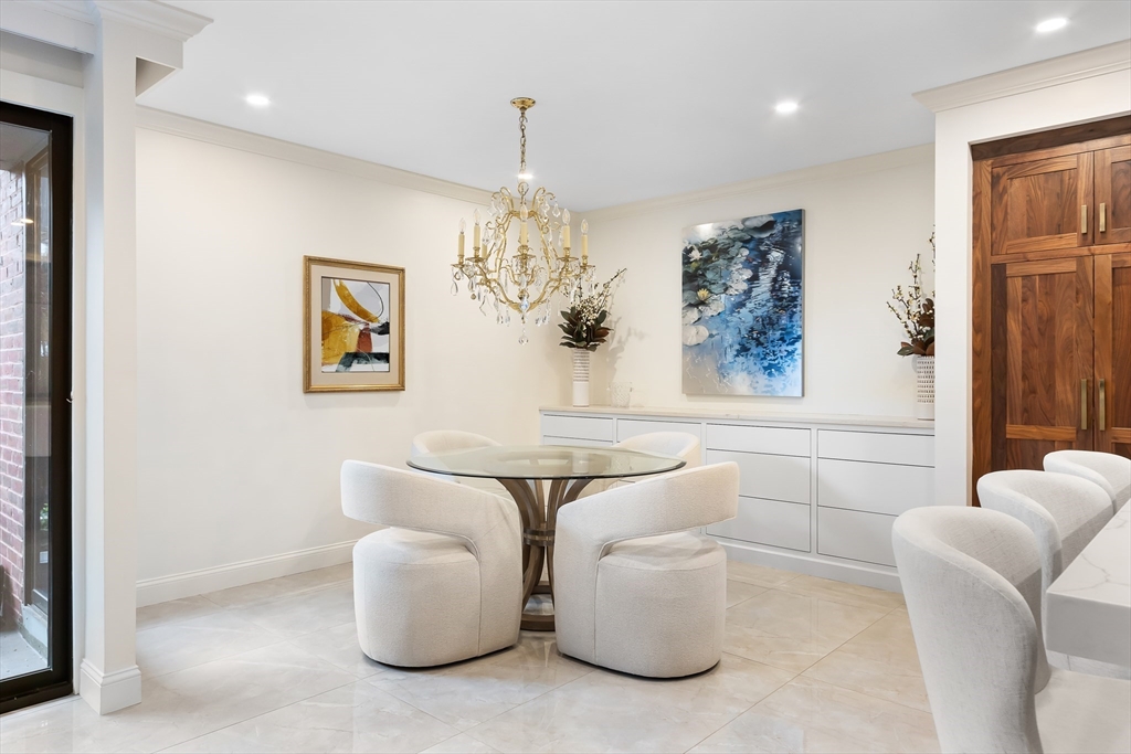 75 Grove Street, Unit 132 Wellesley, MA 02482 - Photo 9 of 20 a living room with furniture and a chandelier