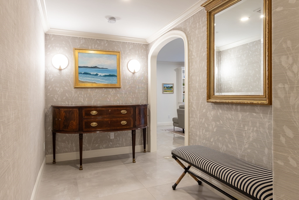 75 Grove Street, Unit 132 Wellesley, MA 02482 - Photo 10 of 20 a view of a hallway with front door and wooden floor