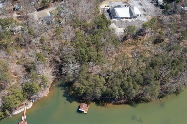 an aerial view of residential house with outdoor space and lake view