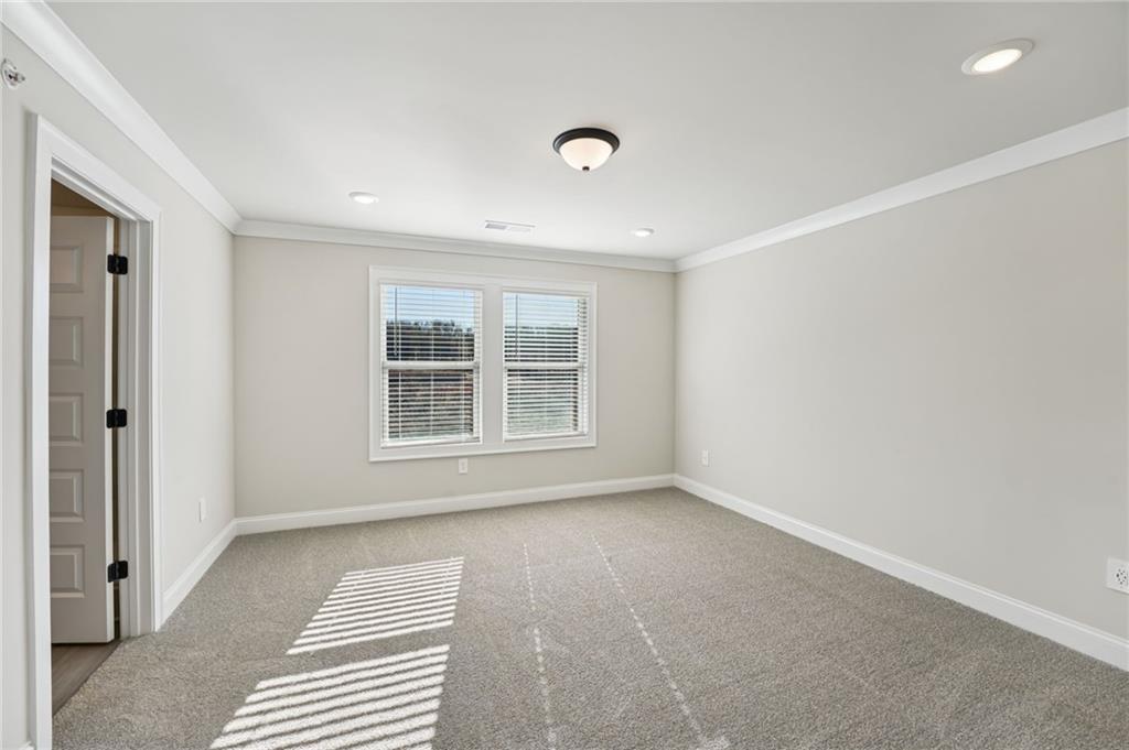 6450 Pinin Place Cumming, GA 30041 - Photo 39 of 53 a view of an empty room with a window