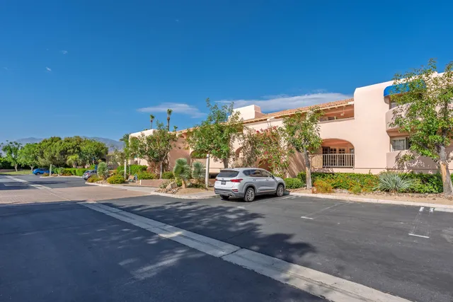 a view of street with parked cars