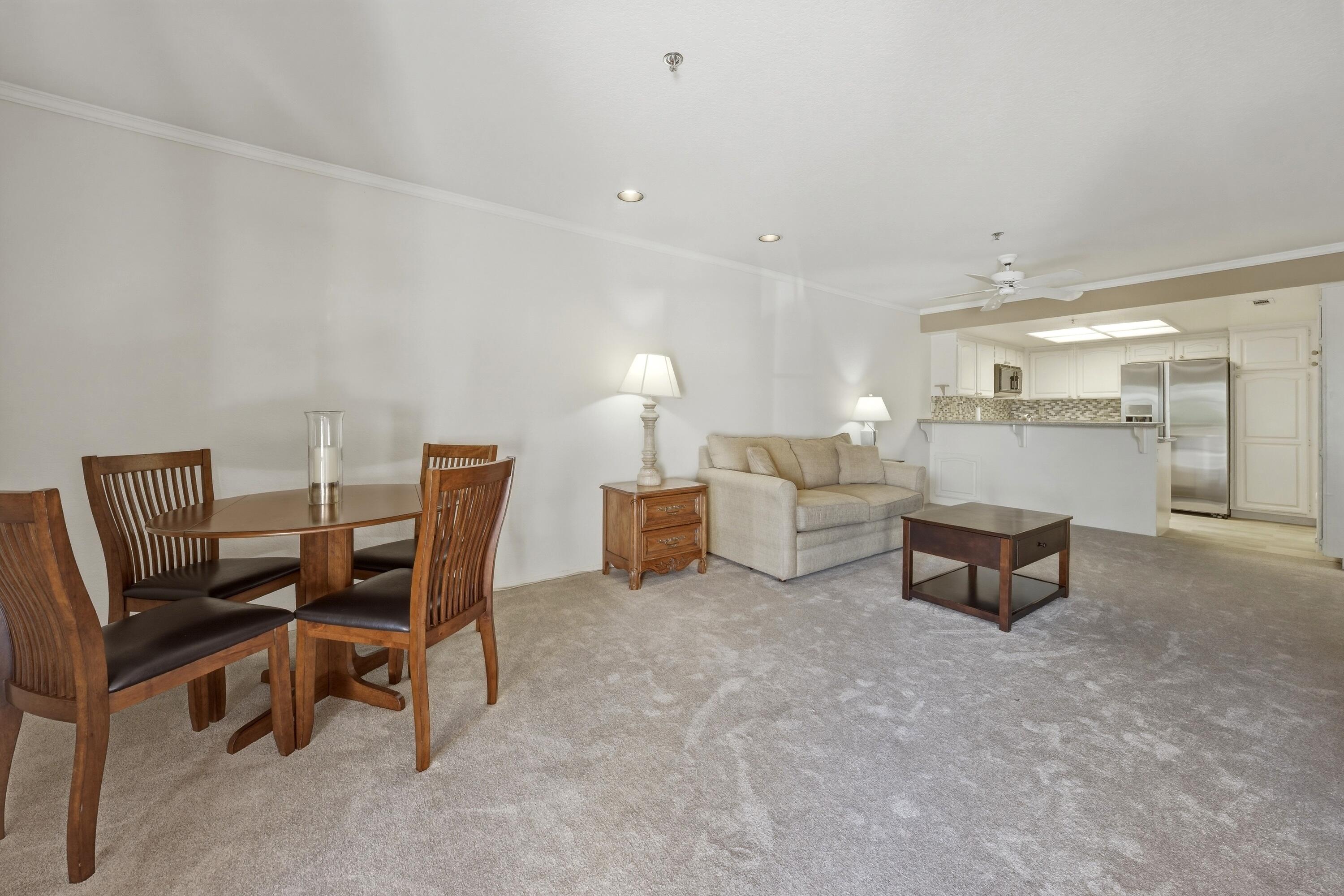 500 East Amado Road, Unit 511 Palm Springs, CA 92262 - Photo 9 of 28 a living room with furniture and a table