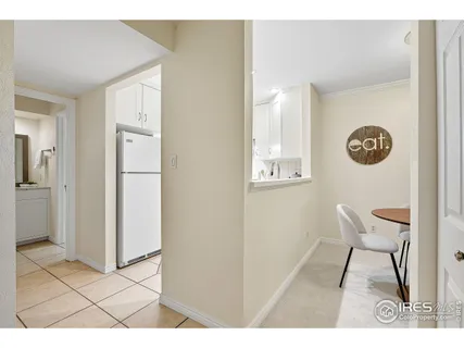 a kitchen with a stove a refrigerator and a sink