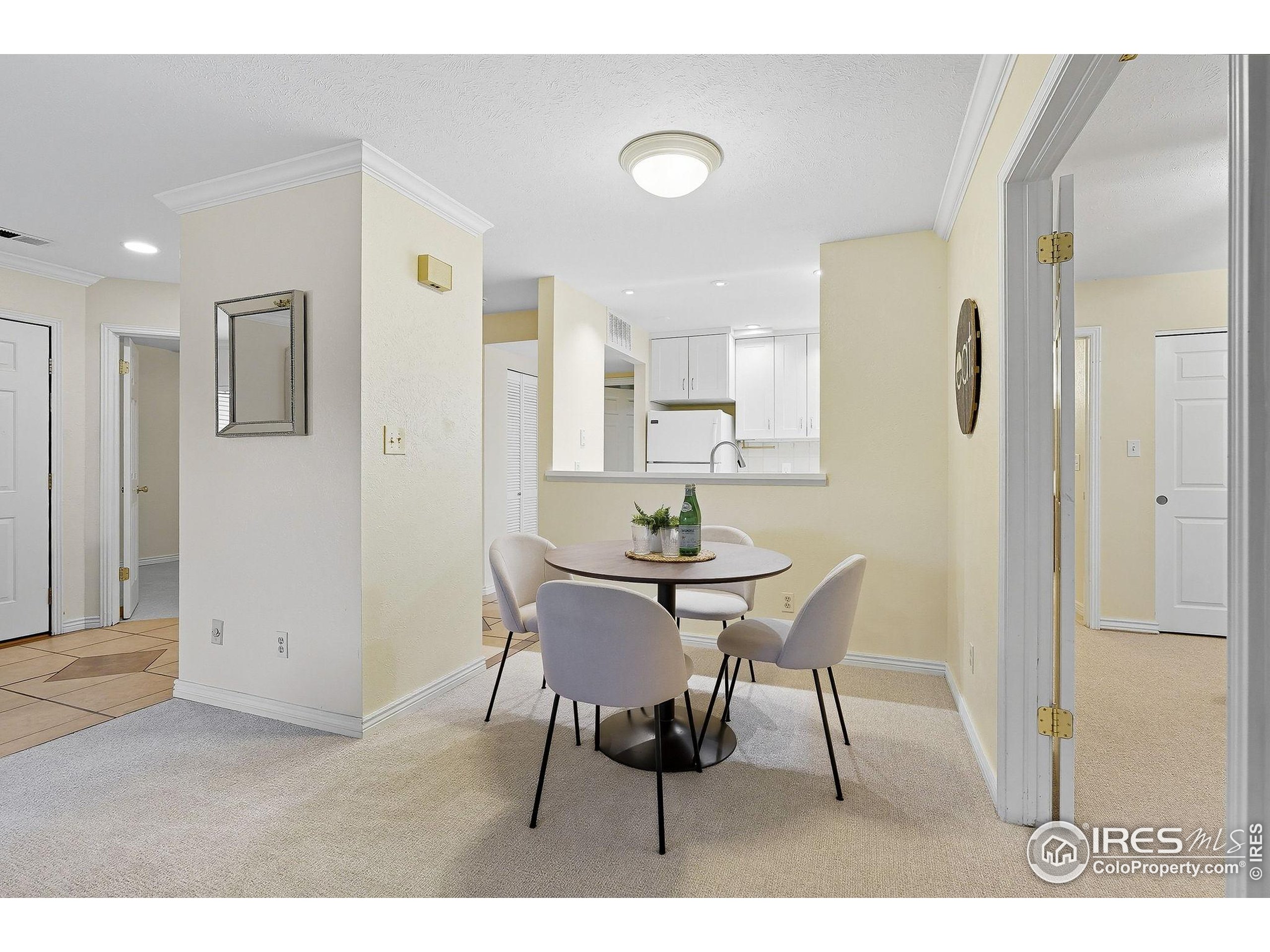 1303 Alpine Avenue, Unit 24 Boulder, CO 80304 - Photo 15 of 46 a view of a dining room with furniture and wooden floor