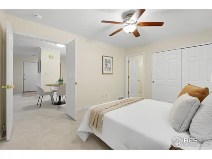 a bedroom with a bed and lamp with window