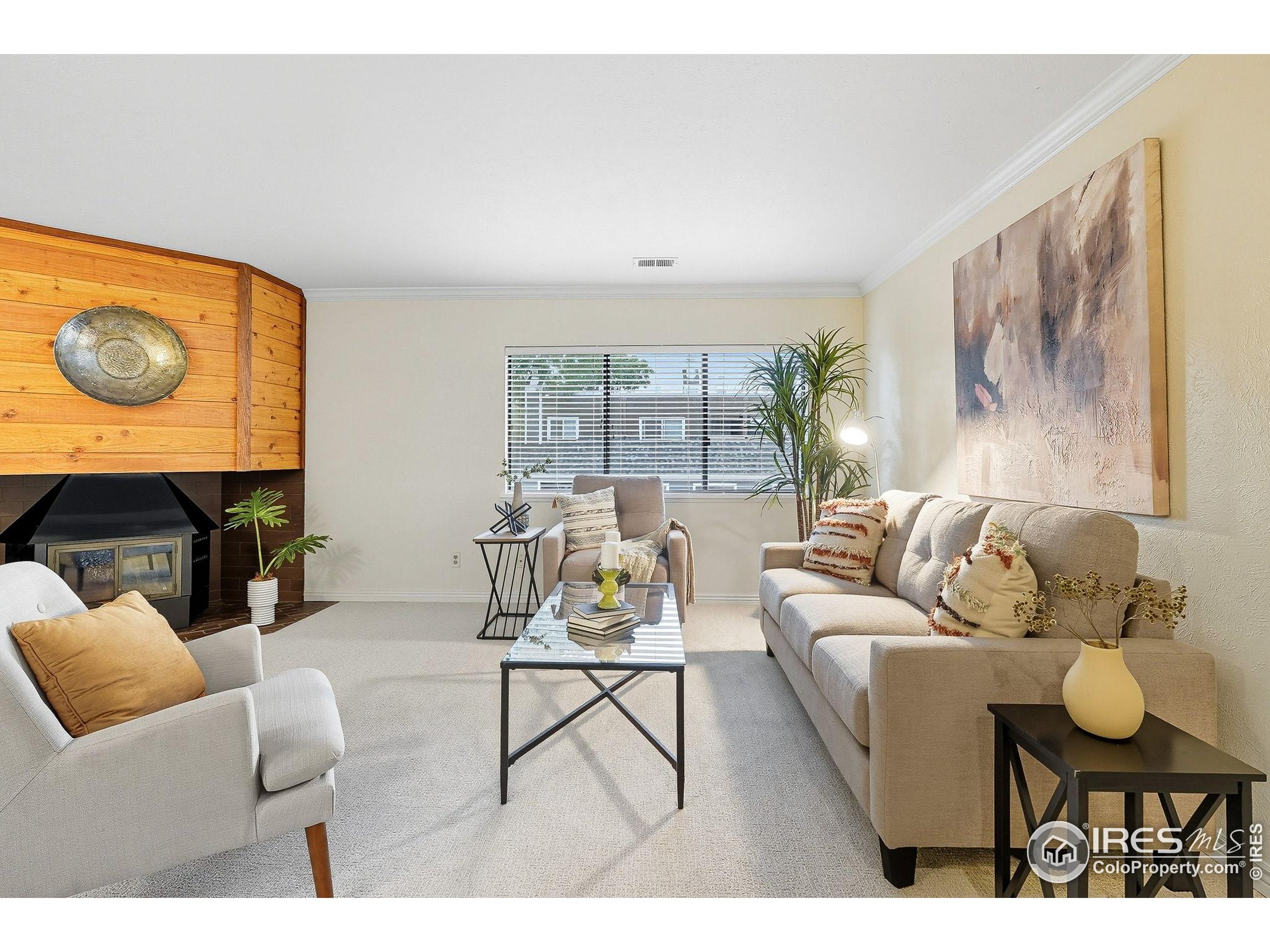 1303 Alpine Avenue, Unit 24 Boulder, CO 80304 - Photo 2 of 46 a living room with furniture and a floor to ceiling window