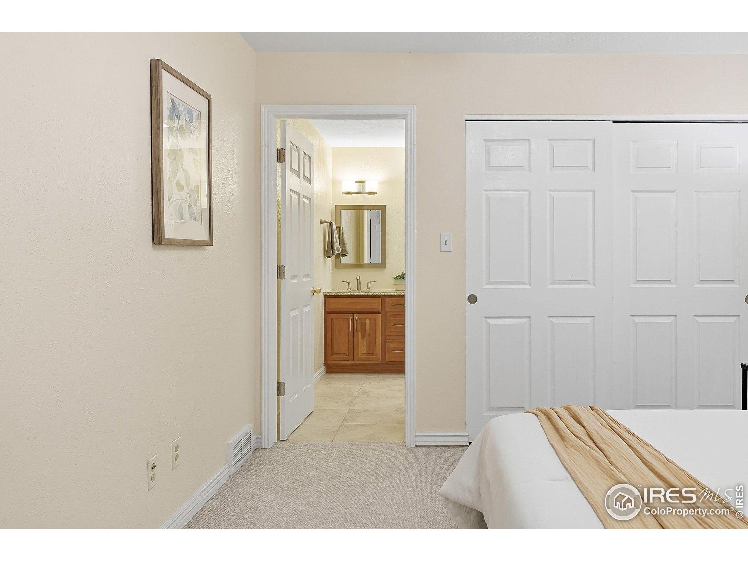 1303 Alpine Avenue, Unit 24 Boulder, CO 80304 - Photo 21 of 46 a view of a bedroom from the hallway