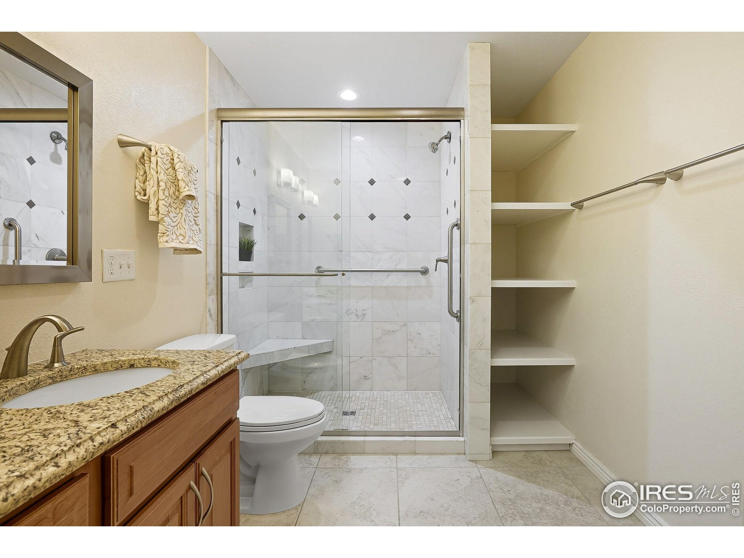 1303 Alpine Avenue, Unit 24 Boulder, CO 80304 - Photo 23 of 46 a bathroom with a granite countertop sink toilet and shower