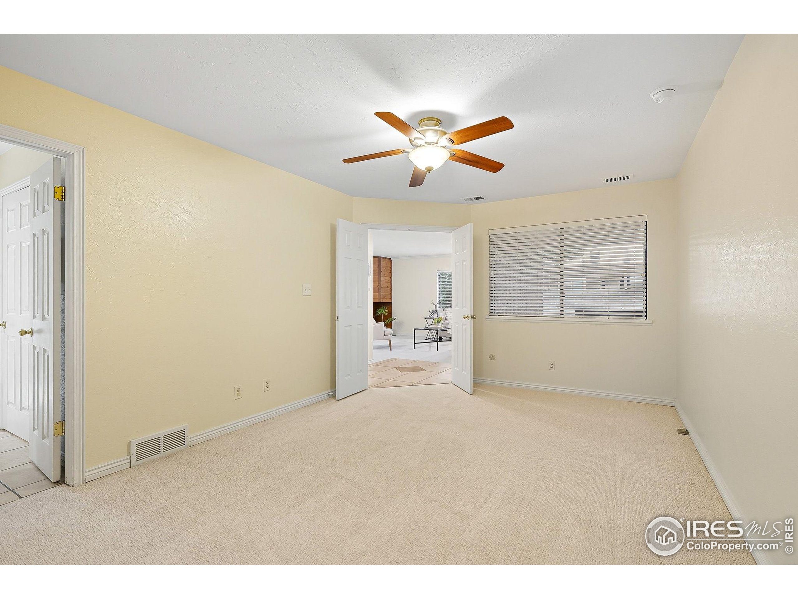 1303 Alpine Avenue, Unit 24 Boulder, CO 80304 - Photo 26 of 46 a view of a livingroom with a ceiling fan and window