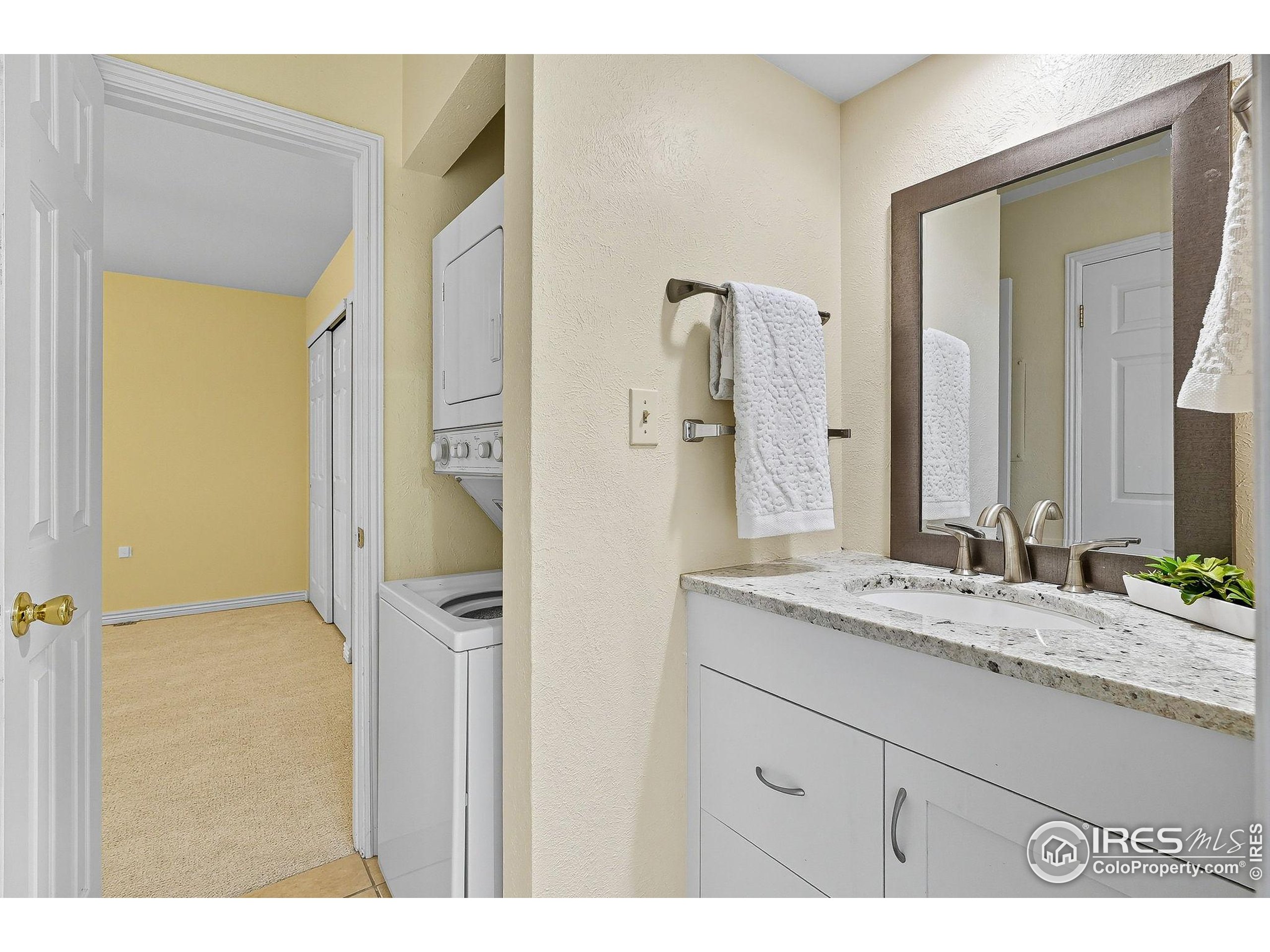 1303 Alpine Avenue, Unit 24 Boulder, CO 80304 - Photo 28 of 46 a bathroom with a granite countertop sink mirror and a shower