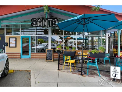 a view of a shop on the street