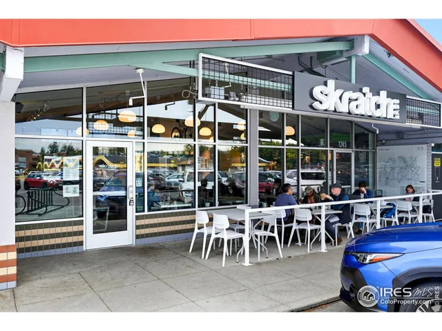 a view of a building with sitting area
