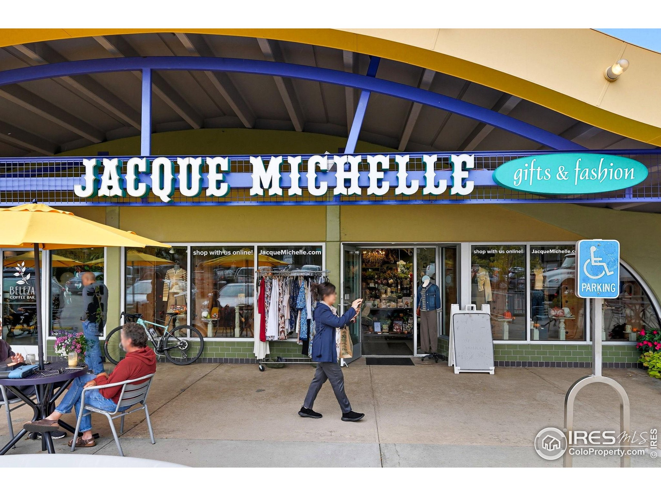 1303 Alpine Avenue, Unit 24 Boulder, CO 80304 - Photo 43 of 46 a view of a cafe with a couple of people in a patio
