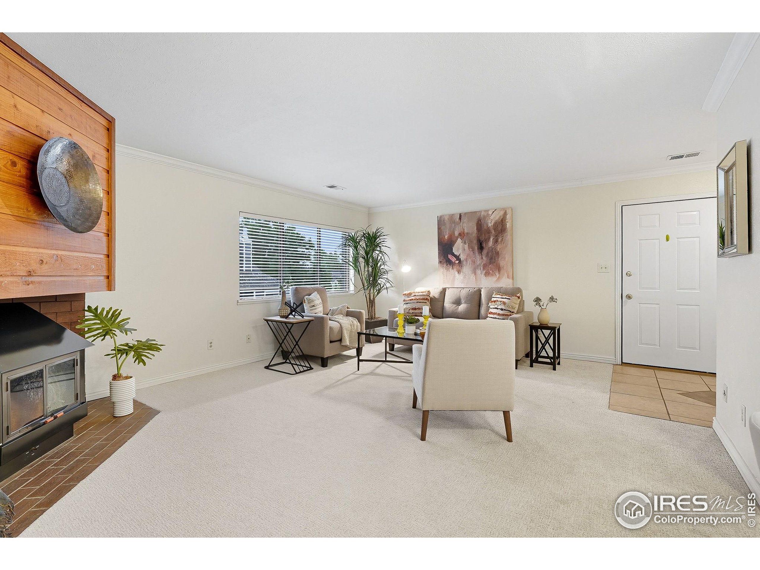 1303 Alpine Avenue, Unit 24 Boulder, CO 80304 - Photo 9 of 46 a living room with furniture and a flat screen tv
