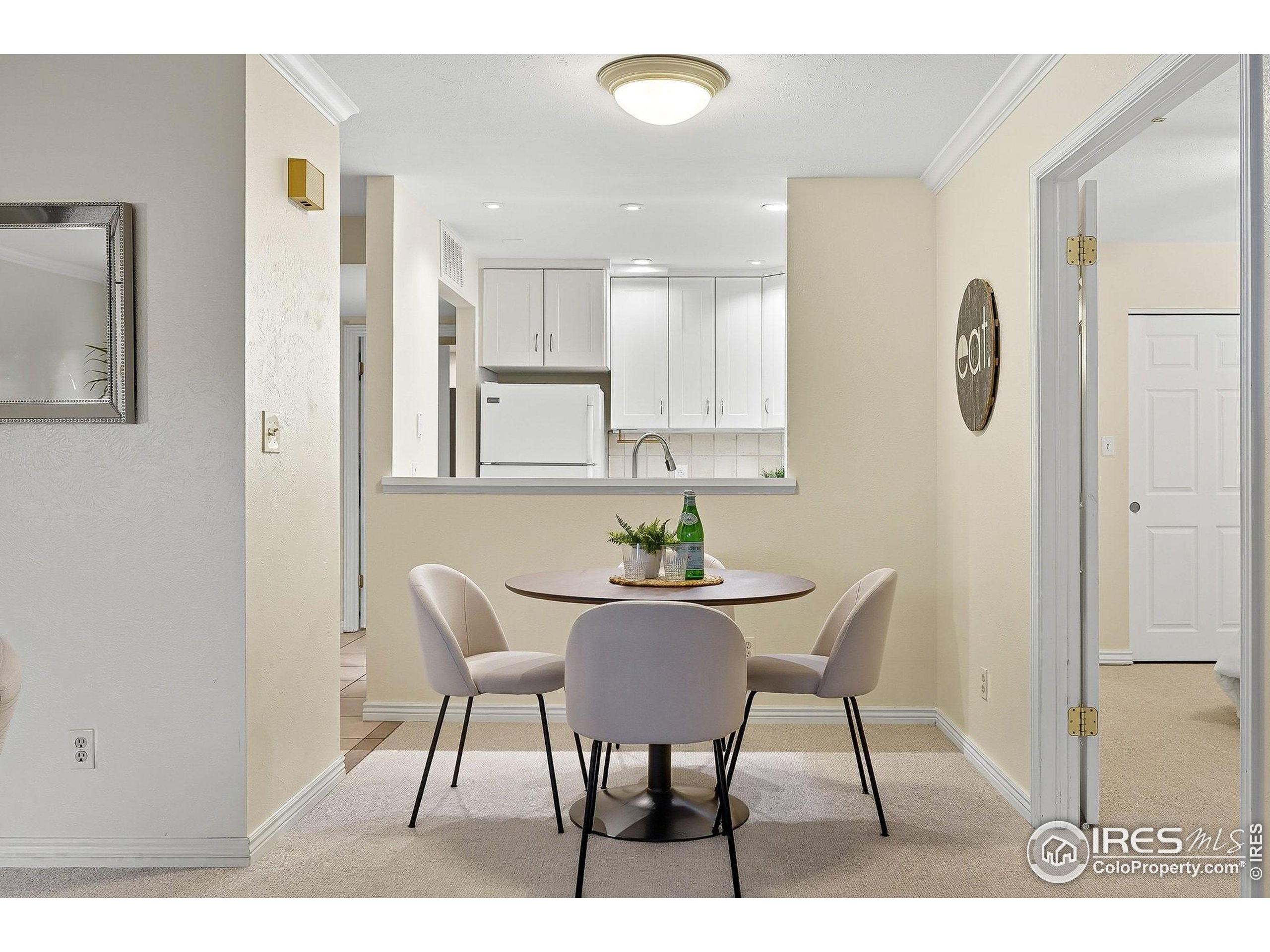 1303 Alpine Avenue, Unit 24 Boulder, CO 80304 - Photo 10 of 46 a view of a dining room with furniture and wooden floor