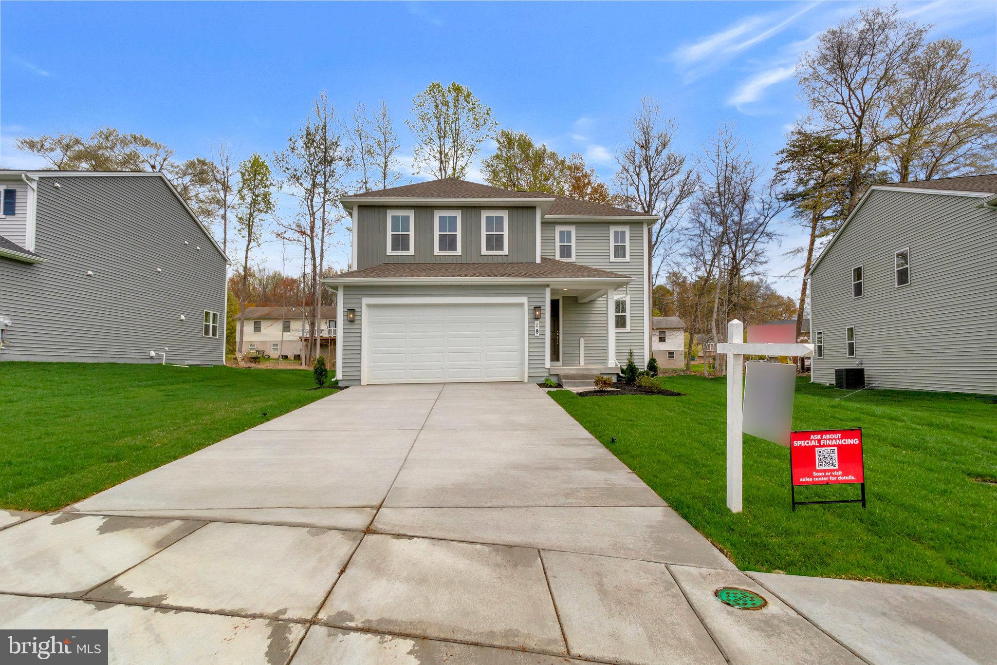 18 Poplar Court North East, MD 21901 - Photo 1 of 42 a front view of a house with garden