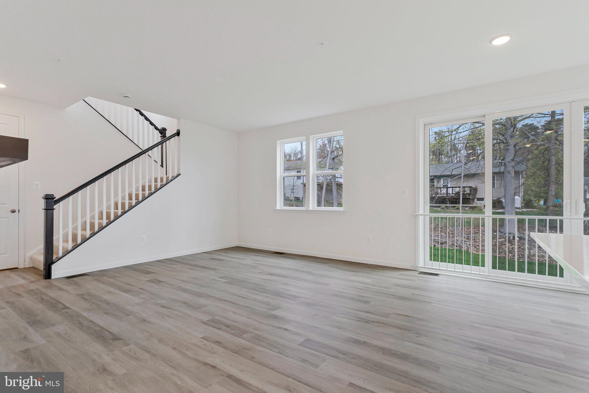 18 Poplar Court North East, MD 21901 - Photo 16 of 42 a view of an empty room with wooden floor and a window