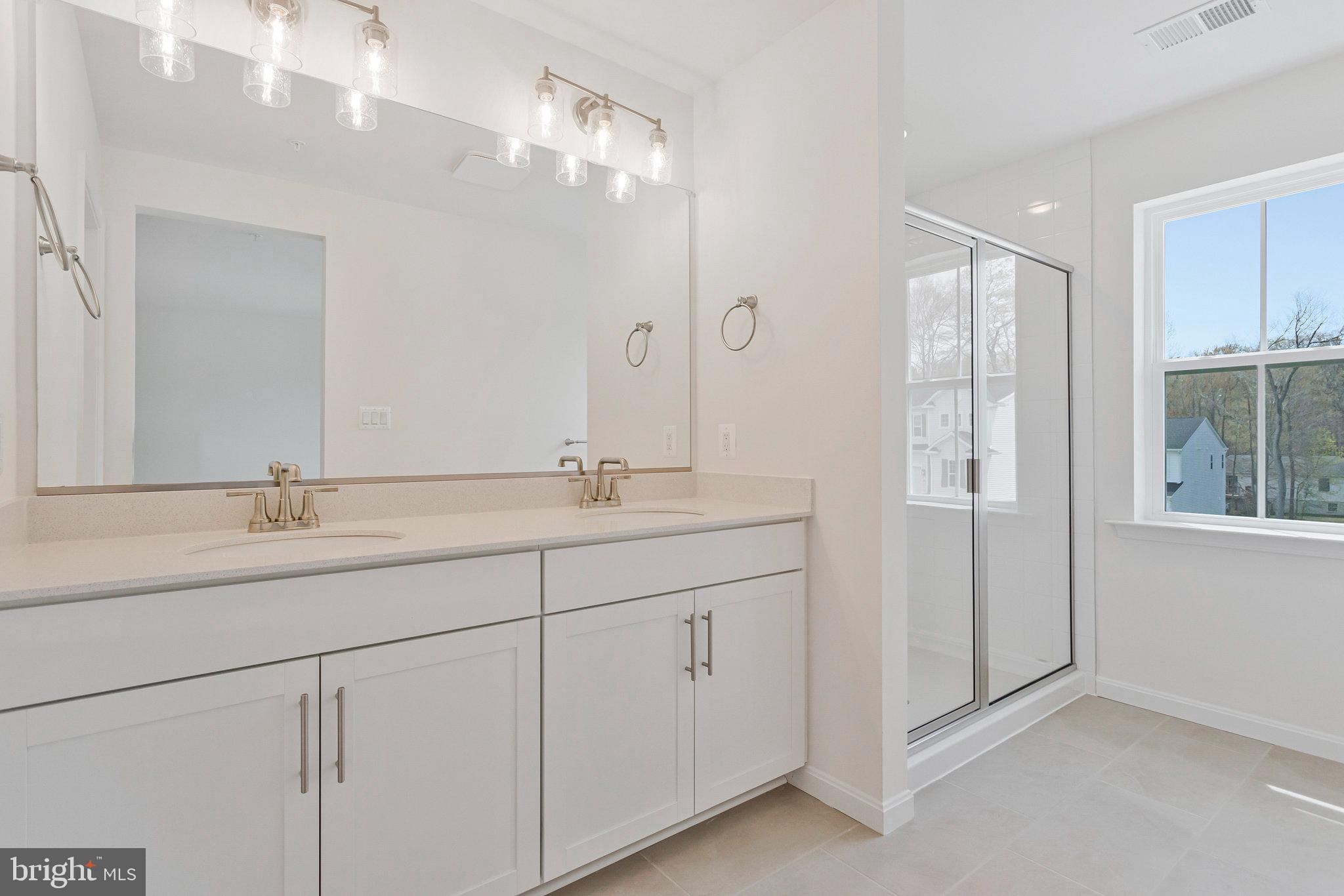 18 Poplar Court North East, MD 21901 - Photo 23 of 42 a bathroom with double sink and a mirror