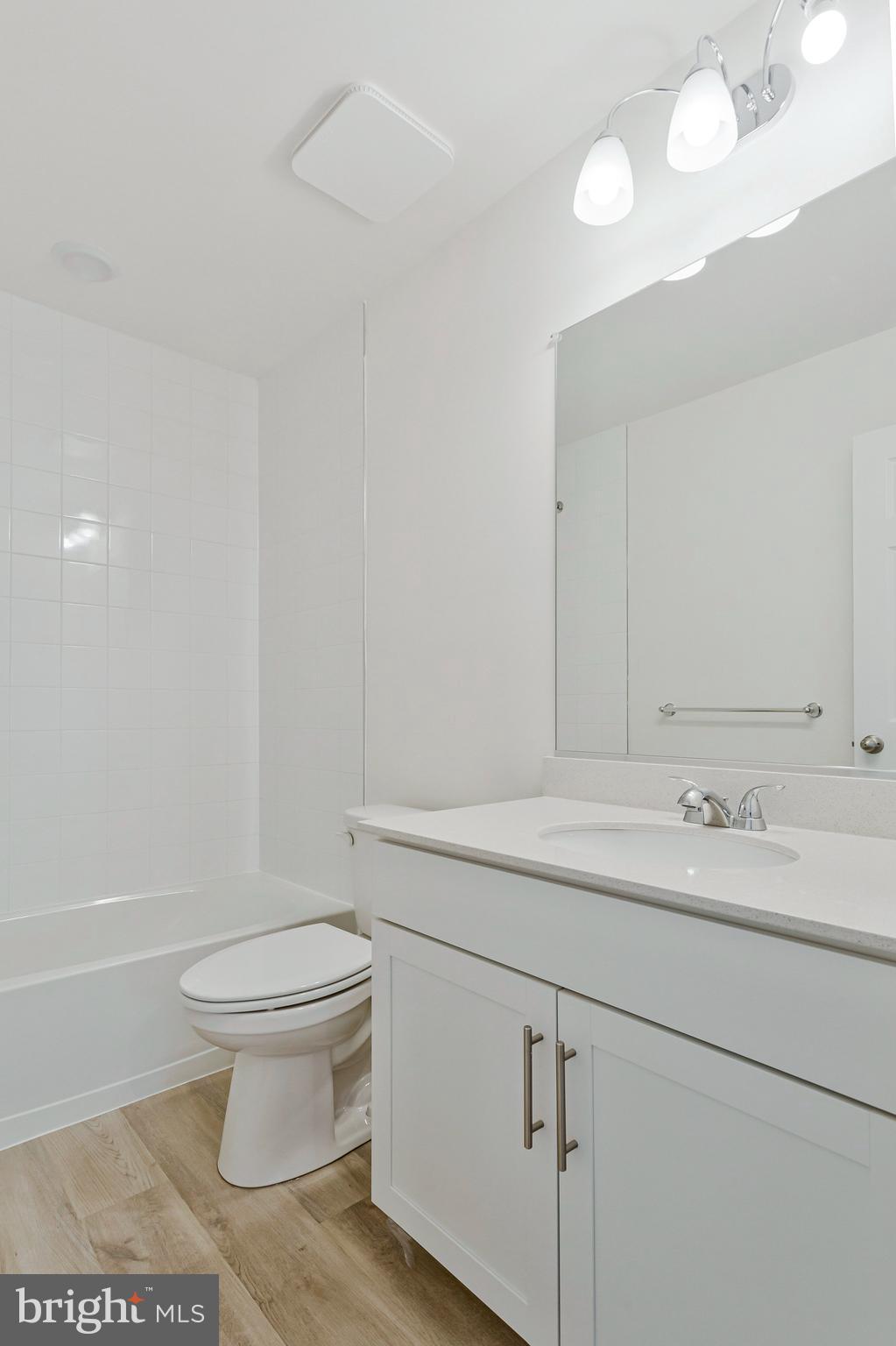 18 Poplar Court North East, MD 21901 - Photo 31 of 42 a bathroom with a sink a toilet and a mirror