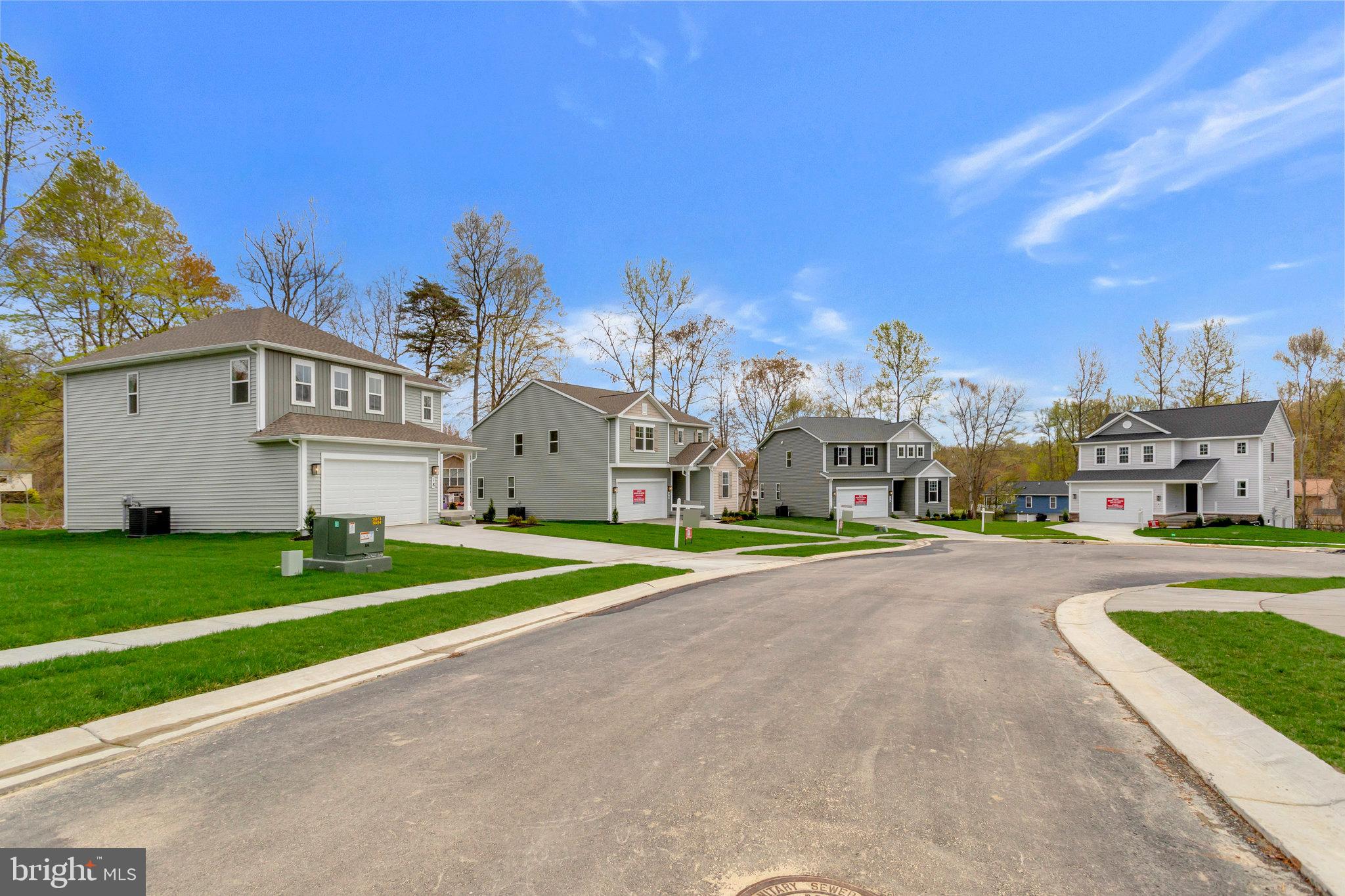 18 Poplar Court North East, MD 21901 - Photo 4 of 42 a front view of a house with a yard and garage