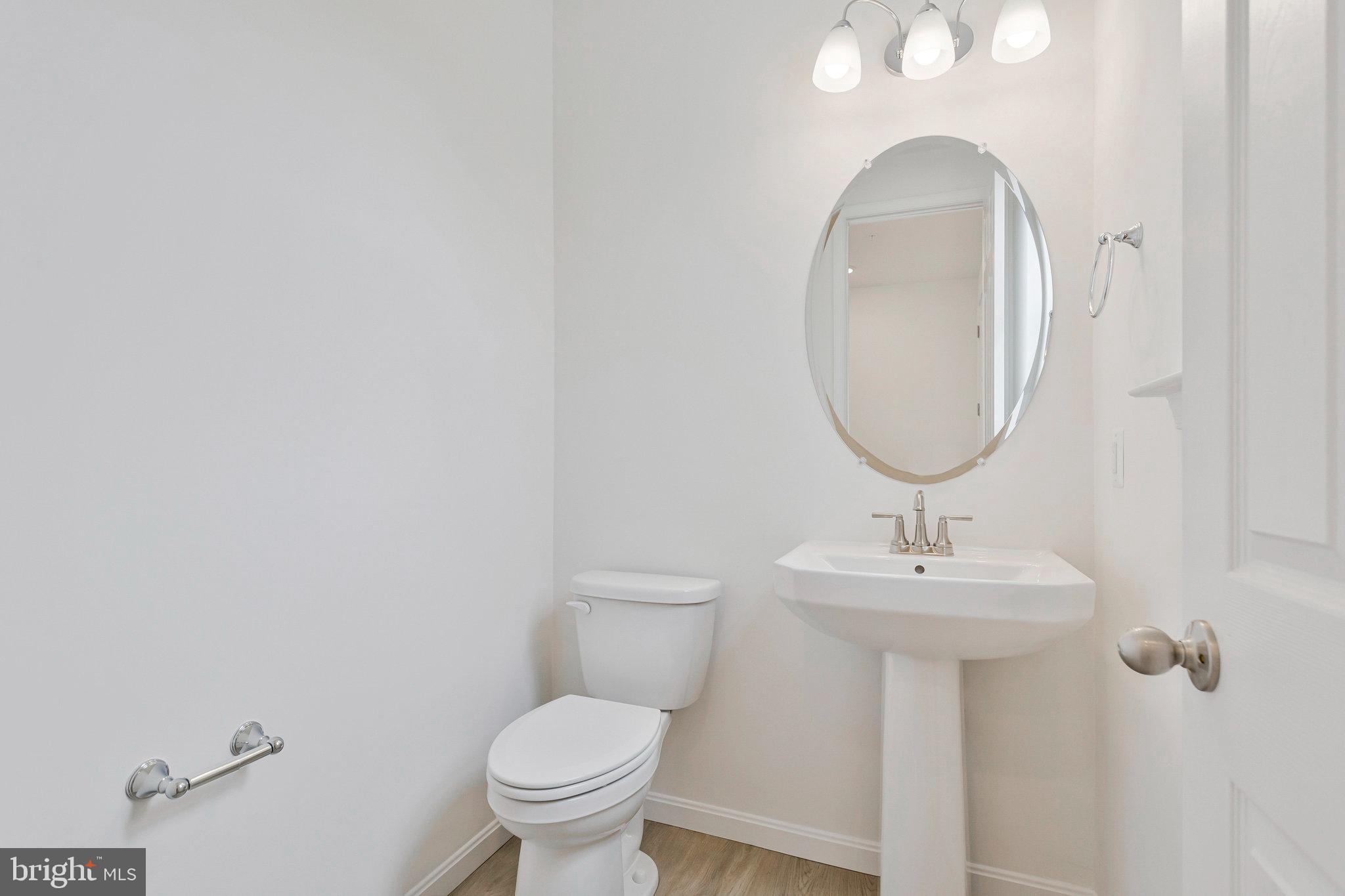 18 Poplar Court North East, MD 21901 - Photo 7 of 42 a bathroom with a toilet sink and mirror