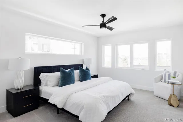 a bedroom with bed and window